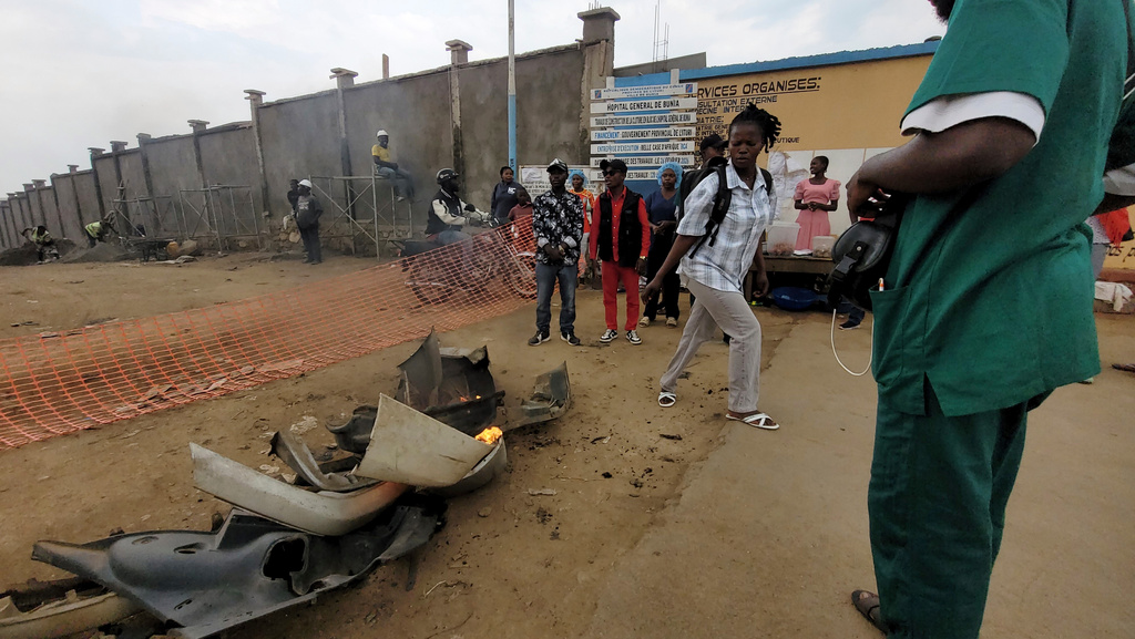 Rubble set on fire as health workers involved in Congo's Ebola response go on strike as they protest over payment issues in Bunia, Congo, Wednesday, July 15, 2026. (AP Photo/Constant Same Bagalwa)