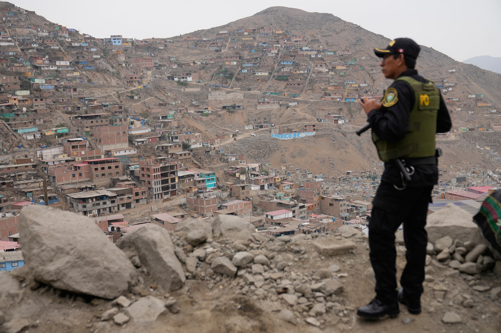 A police officers guard the site where presidential candidate Keiko Fujimori of the Popular Force party meets supporters for breakfast during the presidential runoff election in Lima, Peru, Sunday, June 7, 2026. (AP Photo/Martin Mejia)