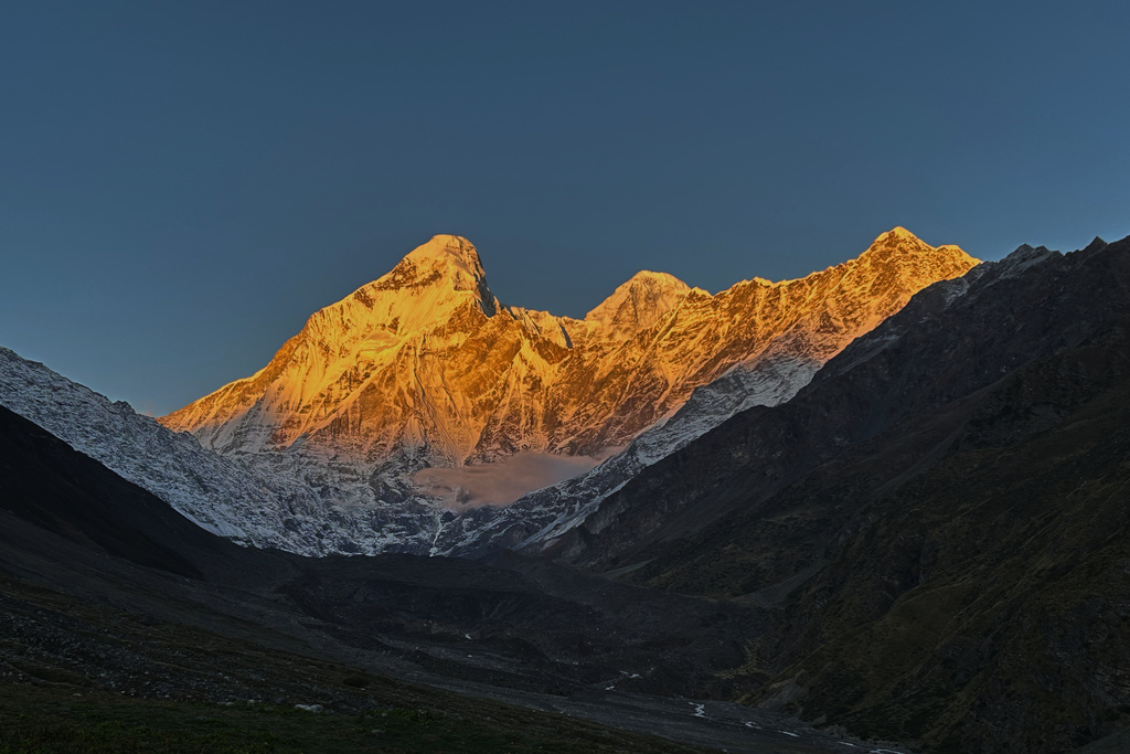 The morning sun illuminates Nanda Devi peak as seen from Nanda Devi base camp, in the northern Indian Himalayan state of Uttarakhand, on Oct. 1, 2025. (AP Photo/Satish Sharma)