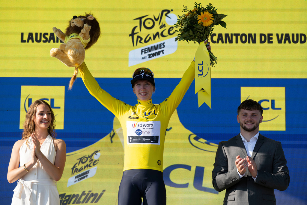 Netherlands' Lorena Wiebes of team SD Worx Protime celebrates on the podium after winning the first stage of the Women's Tour de France cycling race (Tour de France Femmes), in Lausanne, Switzerland, Saturday, Aug. 1, 2026. (Jean-Christophe Bott/Keystone via AP)