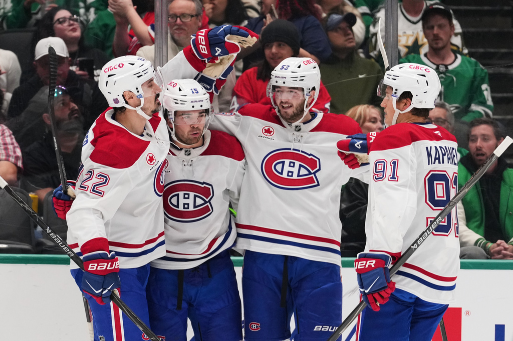 Montr&eacute;al Canadiens' Chris Kreider (22), Alex Newhook (15), Noah Dobson (53) and Oliver Kapanen (91) celebrate after Newhook scored against the Dallas Stars in the second period of an NHL hockey game in Dallas, Thursday Oct. 29, 2026. (AP Photo/Tony Gutierrez)