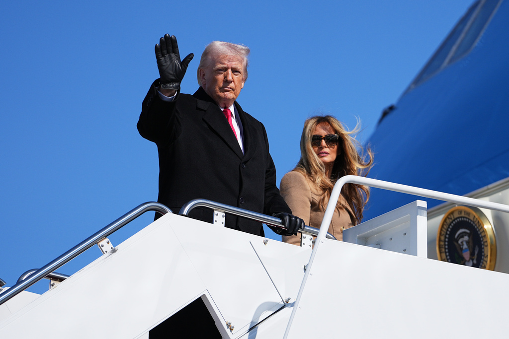 President Donald Trump and first lady Melania Trump, board Air Force One, at Joint Base Andrews, Md., Friday, Feb. 13, 2026, en route to Fort Bragg. (AP Photo/Matt Rourke)