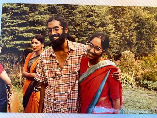 Tejaswini Rao chats with party guests while Subramanyam and Saraswathi Vedam embrace during their parents' wedding anniversary party at State College, Pa., in August 1981. (Saraswathi Vedam via AP) Tejaswini Rao chats with party guests while Subramanyam and Saraswathi Vedam embrace during their parents' wedding anniversary party at State College, Pa., in August 1981. (Saraswathi Vedam via AP)