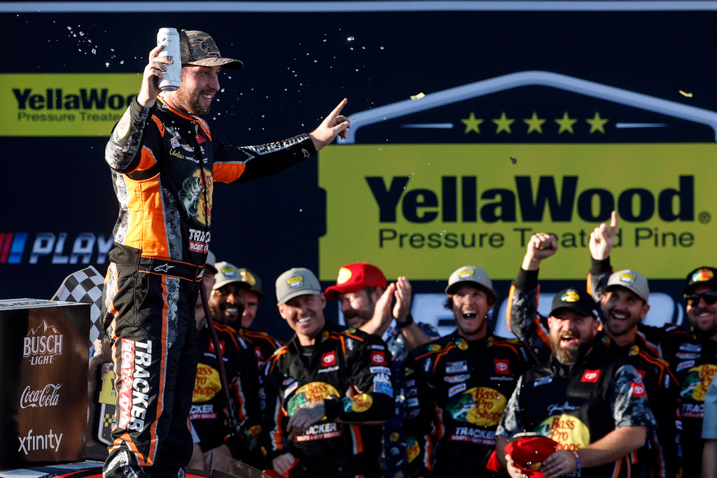 Driver Chase Briscoe celebrates in Victory Lane after winning a NASCAR Cup Series auto race at Talladega Superspeedway, Sunday, Oct. 19, 2025, in Talladega, Ala. (AP Photo/Butch Dill)