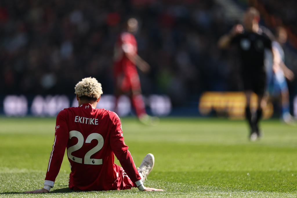 Liverpool's Hugo Ekitike isits injured during the English Premier League soccer match between Brighton and Liverpool in Brighton, Saturday, March 21, 2026. (AP Photo/Ian Walton)
