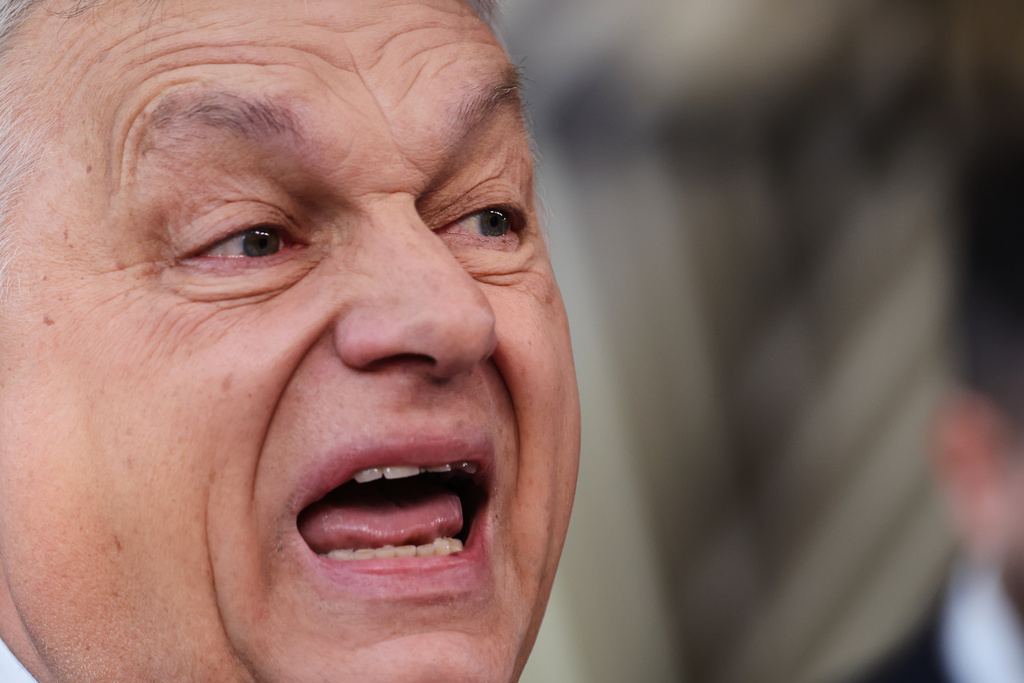 Hungary's Prime Minister Viktor Orban speaks with the media as he arrives for the EU summit at the European Council building in Brussels, Thursday, March 19, 2026. (AP Photo/Omar Havana)