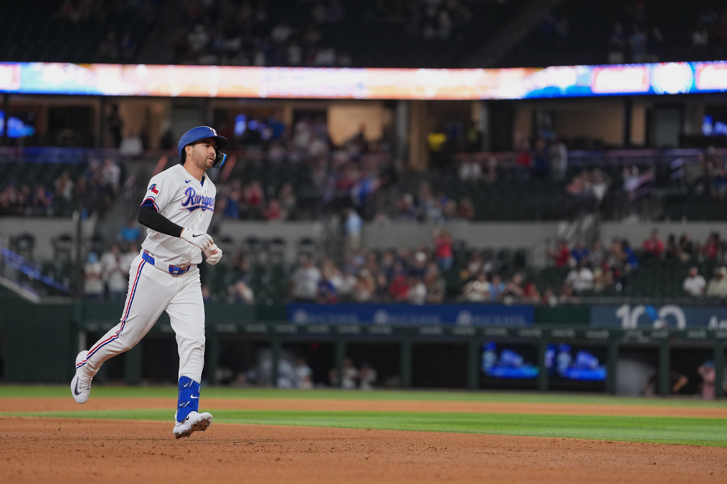 Texas Rangers pinch hitter Kyle Higashioka runs the bases after hitting a solo home run against the Los Angeles Angels during the eighth inning of a baseball game, Wednesday, July 8, 2026, in Arlington, Texas. (AP Photo/Julio Cortez)