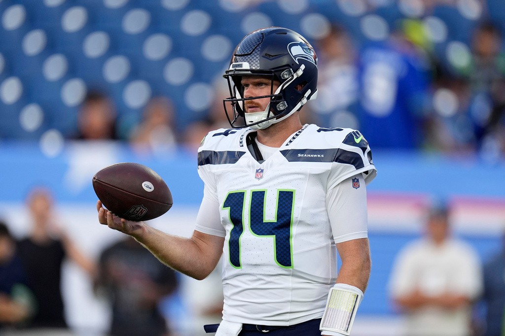 Seattle Seahawks quarterback Sam Darnold warms up before a preseason NFL football game against the Tennessee Titans, Sunday, Aug. 23, 2026, in Nashville, Tenn. (AP Photo/George Walker IV)