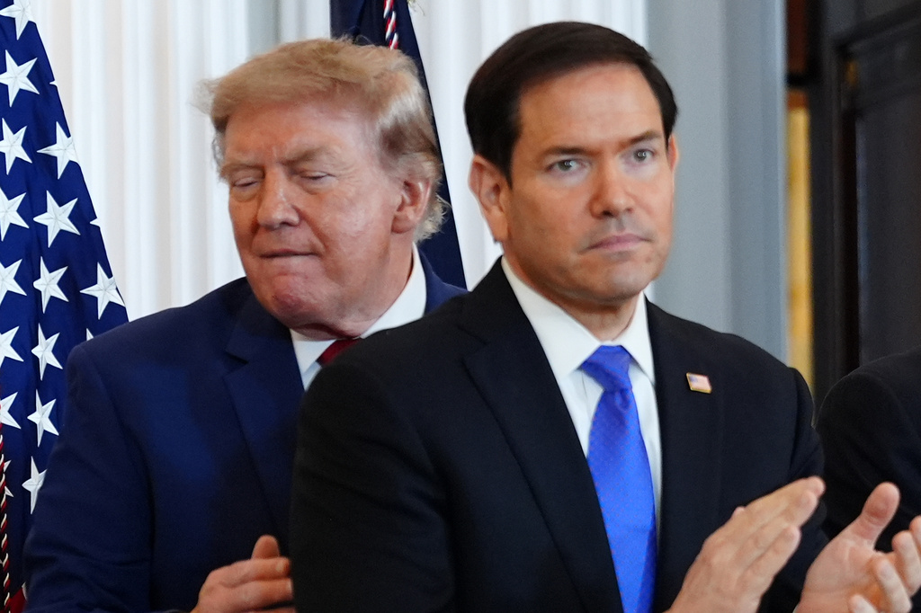 President Donald Trump walks past Secretary of State Marco Rubio as he arrives for a roundtable on the American mining industry, Friday, Aug. 7, 2026, at the State Department in Washington. (AP Photo/Julia Demaree Nikhinson)