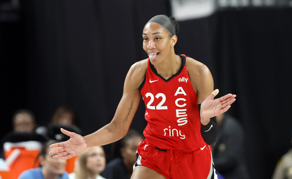 Las Vegas Aces center A'ja Wilson (22) celebrates after a basket against the Chicago Sky during the first half of a WNBA basketball game Sunday, Sept. 7, 2025, in Las Vegas. (Steve Marcus/Las Vegas Sun via AP)