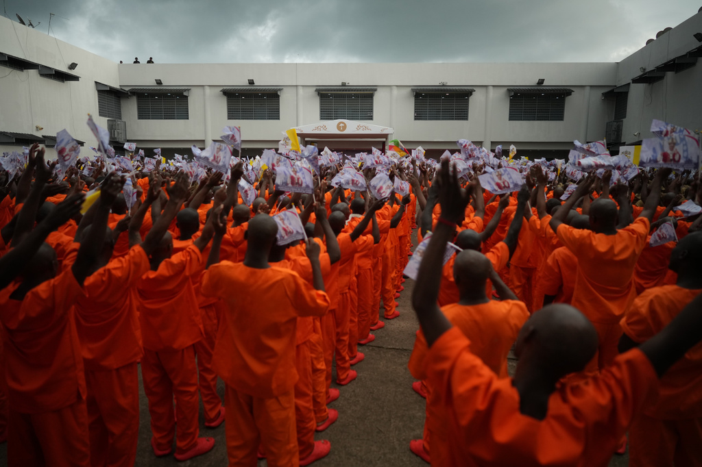 Inmates of the Bata Prison meet with Pope Leo XIV during his visit to Equatorial Guinea, Wednesday, April 22, 2026. (AP Photo/Andrew Medichini)