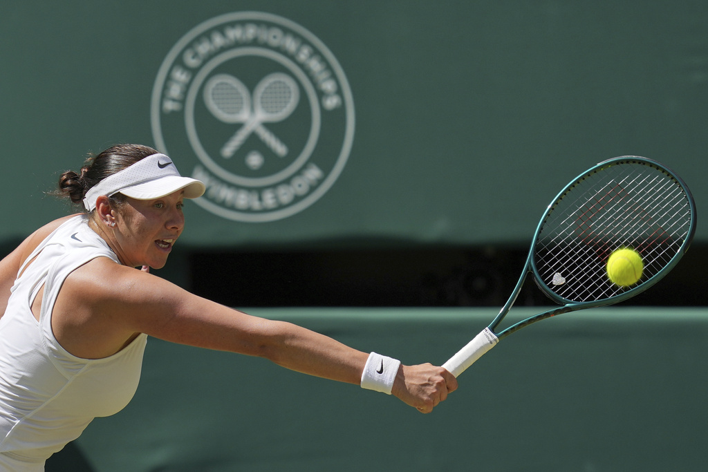 Amanda Anisimova of the U.S. returns to Aryna Sabalenka of Belarus during a women's singles semifinal match at the Wimbledon Tennis Championships in London, Thursday, July 10, 2025. (AP Photo/Kin Cheung)