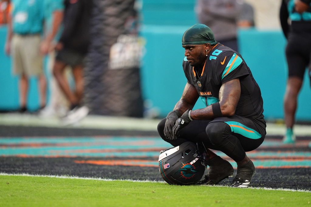 FILE - Miami Dolphins' Tyreek Hill looks toward the field son the sideline before an NFL football game against the New York Jets, Sept. 29, 2025, in Miami Gardens, Fla. (AP Photo/Rebecca Blackwell, file)