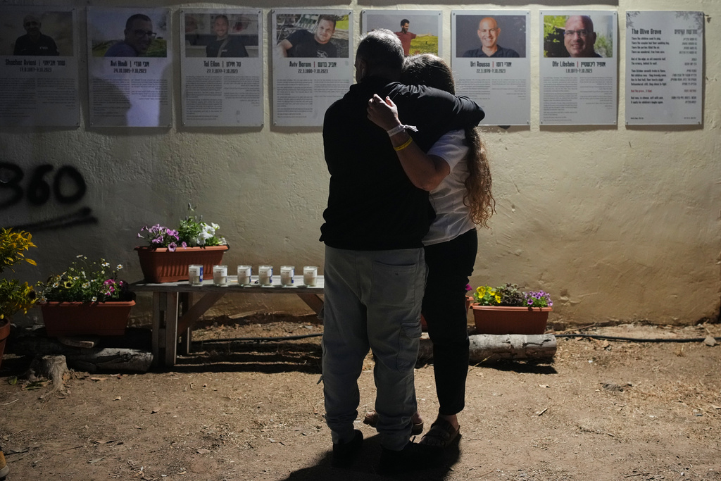 People attend a memorial service marking two years since the Oct. 7, 2023, Hamas cross-border attack on Israel, in Kibbutz Kfar Aza, southern Israel where many of its community members were Killed and abducted, Tuesday, Oct. 7, 2025. (AP Photo/Ohad Zwigenberg)