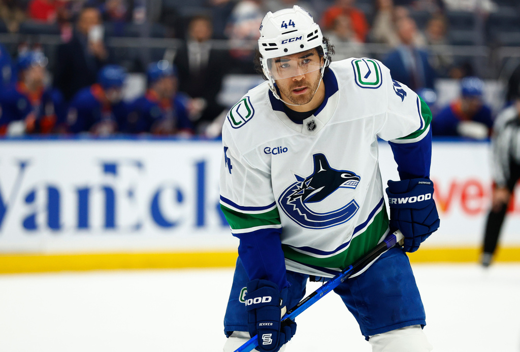 Vancouver Canucks left wing Kiefer Sherwood looks on during the first period of an NHL hockey game against the New York Islanders, Friday, Dec. 19, 2025, in Elmont, NY. (AP Photo/Noah K. Murray)
