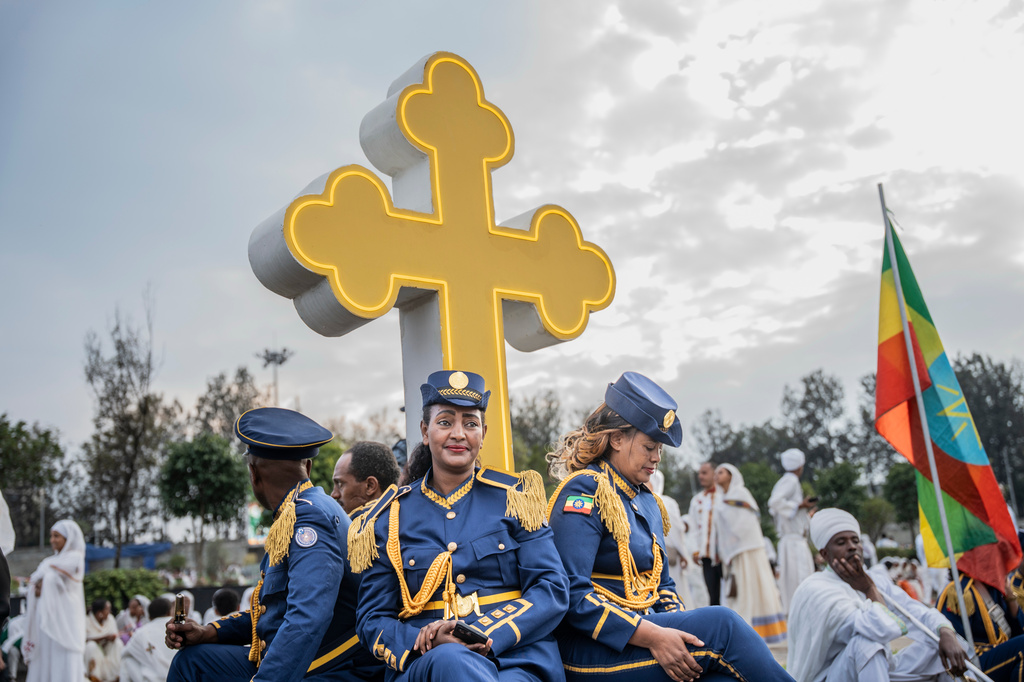 Members of Ethiopian Federal police march band look on during celebrations for the Orthodox holiday of Meskel, an annual holiday celebrating the discovery of the True Cross in the fourth century by the Roman Empress Helena, in Addis Ababa, Ethiopia, Saturday, Sept. 26, 2026. (AP Photo/Amanuel Sileshi)