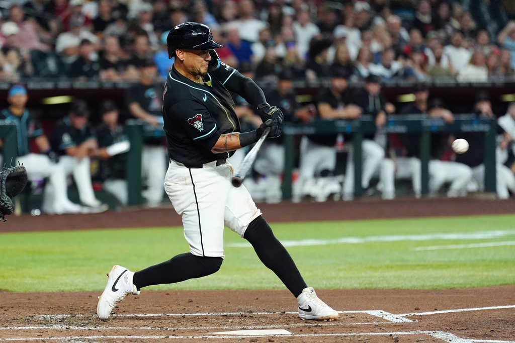 Arizona Diamondbacks' Ildemaro Vargas starts his swing on a three-run home run against the Chicago White Sox during the second inning of a baseball game, Wednesday, April 22, 2026, in Phoenix. (AP Photo/Ross D. Franklin)
