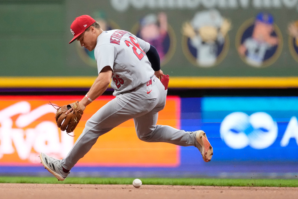 St. Louis Cardinals' JJ Wetherholt is unable to field a ground ball hit by Milwaukee Brewers' Christian Yelich during the sixth inning of a baseball game Tuesday, May 26, 2026, in Milwaukee. (AP Photo/Aaron Gash)