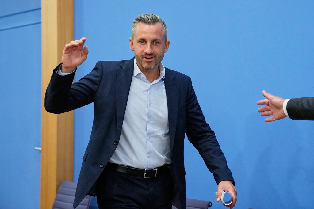 Top candidate for the Saxony-Anhalt state elections Ulrich Siegmund, center, attends a press conference in Berlin, Germany, Monday, Sept. 7, 2026. (AP Photo/Ebrahim Noroozi)
