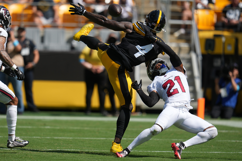 Atlanta Falcons cornerback Mike Hughes (21) breaks up a pass intended for Pittsburgh Steelers wide receiver Dk Metcalf (4) during an NFL football game, Sunday, Sept. 13, 2026, in Pittsburgh. (AP Photo/Gene J. Puskar)