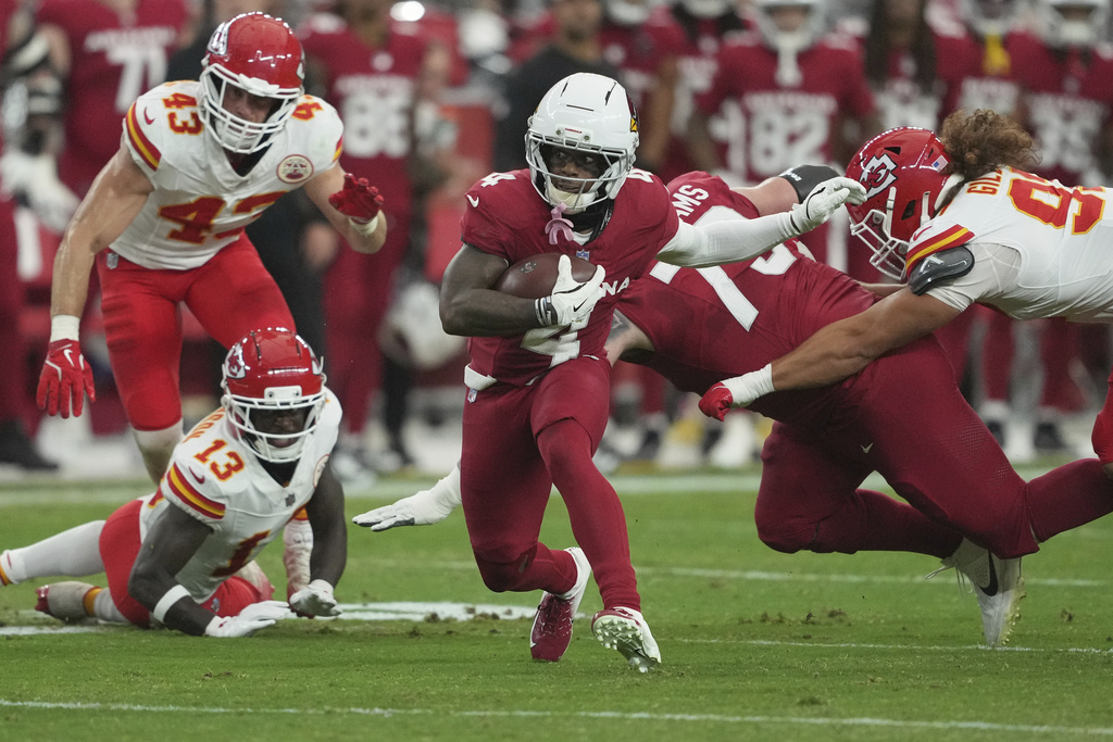 Arizona Cardinals wide receiver Greg Dortch (4) runs the ball against the Kansas City Chiefs during the first half of an NFL preseason football game, Saturday, Aug. 9, 2025, in Glendale. (AP Photo/Rick Scuteri)