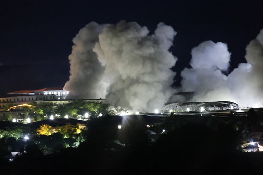 White smoke billows after an explosion at KK Park online scam center in Myawaddy township, Karen State, Myanmar, Saturday, Oct. 25, 2025. (AP Photo/Sarot Meksophawannakul) White smoke billows after an explosion at KK Park online scam center in Myawaddy township, Karen State, Myanmar, Saturday, Oct. 25, 2025. (AP Photo/Sarot Meksophawannakul)