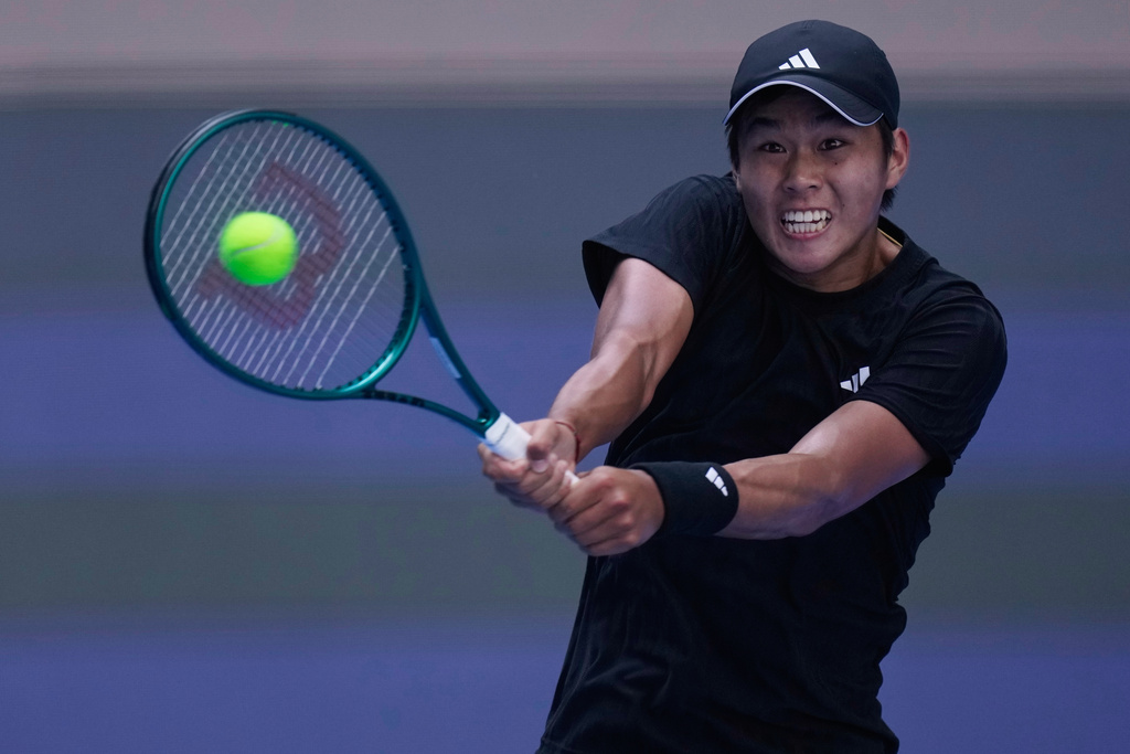 Learner Tien of the United States plays a backhand return to Flavio Cobolli of Italy during the men's singles match of the China Open tennis tournament, at the National Tennis Center, in Beijing, China, Sunday, Sept. 28, 2025. (AP Photo/Mahesh Kumar A.)