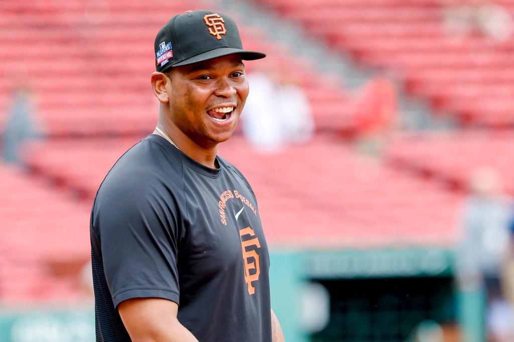 San Francisco Giants' Rafael Devers reacts to being back at Fenway Park before a baseball game against the Boston Red Sox, Friday, Aug. 21, 2026, in Boston. (AP Photo/Greg M. Cooper)