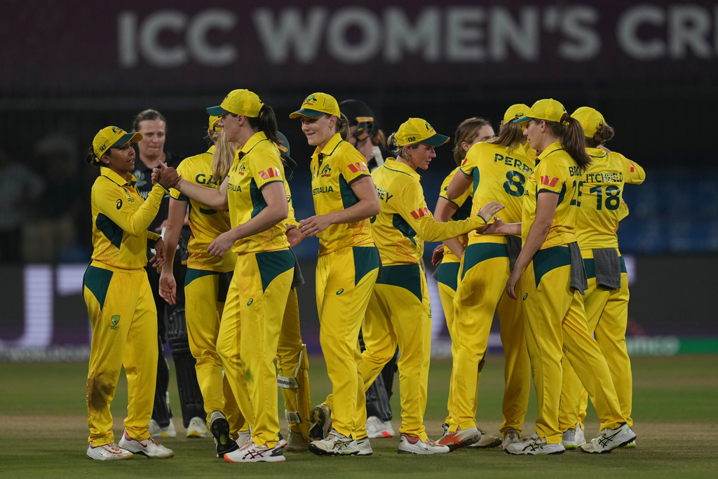 Australia's players celebrate after their win against New Zealand during the ICC Women's Cricket World Cup match at Holkar Cricket Stadium in Indore, India, on Wednesday, Oct. 1, 2025. (AP Photo/Rafiq Maqbool)