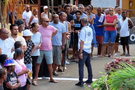 People line up to cast their votes at Beau Vallon Secondary School in Beau Vallon, Seychelles, on Saturday, Sep. 27, 2025. (AP Photo/Emilie Chetty) People line up to cast their votes at Beau Vallon Secondary School in Beau Vallon, Seychelles, on Saturday, Sep. 27, 2025. (AP Photo/Emilie Chetty)