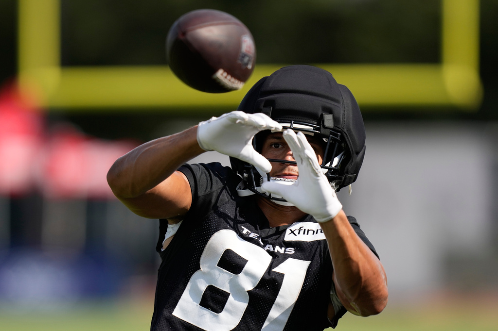 Houston Texans wide receiver Jayden Higgins works out during the team's NFL football training camp in Houston, Friday, August 7, 2026. (AP Photo/Ashley Landis)