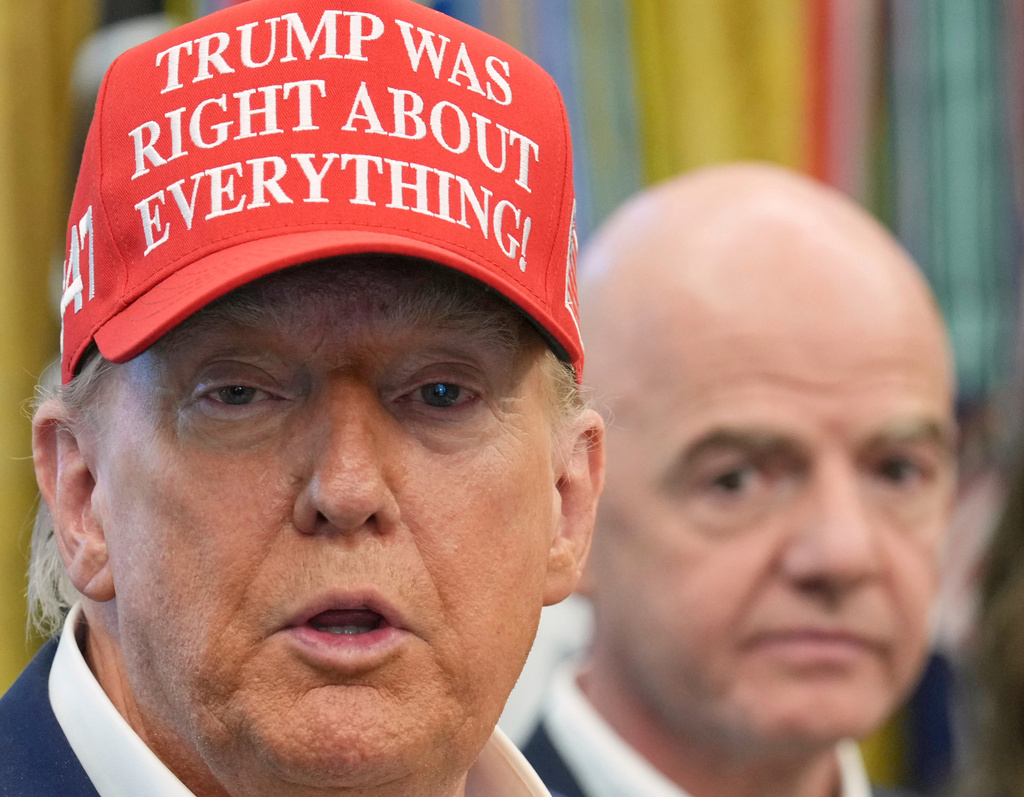 FILE - President Donald Trump speaks as FIFA President Gianni Infantino listens in the Oval Office of the White House, Friday, Aug. 22, 2025, in Washington. (AP Photo/Jacquelyn Martin, File)
