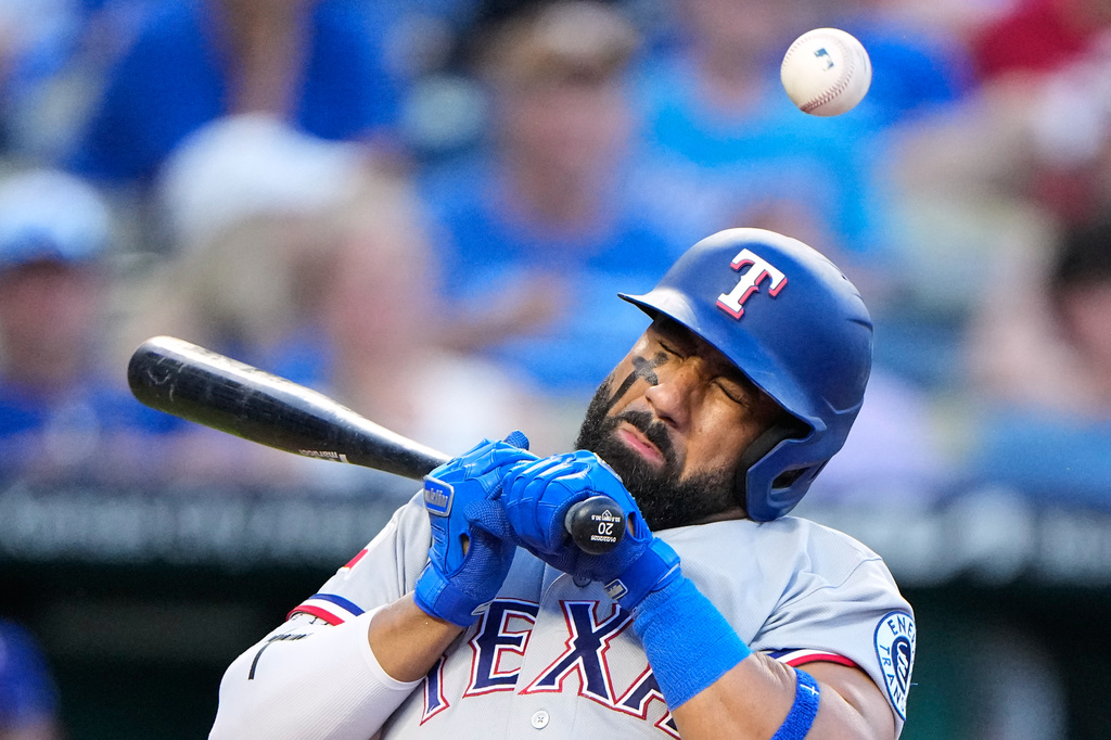 Texas Rangers' Ezequiel Duran reacts after being hit by a pitch thrown by Kansas City Royals pitcher Mason Black during the fourth inning of a baseball game, Wednesday, June 10, 2026, in Kansas City, Mo. (AP Photo/Charlie Riedel)