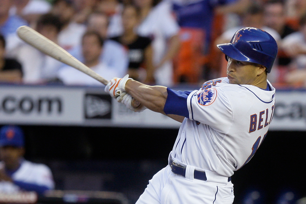 FILE - New York Mets' Carlos Beltran follows through on a line-drive single to center field that scored Jose Reyes and Luis Castillo during the fourth inning against the Arizona Diamondbacks in a baseball game June 11, 2008, in New York. (AP Photo/Julie Jacobson, File)