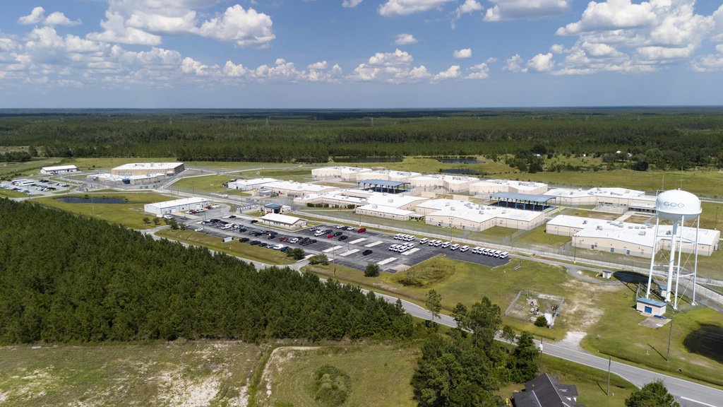 FILE - The Folkston ICE Processing Center, a private prison operated by The GEO Group, Inc., under contract with the U.S. Immigration and Customs Enforcement is seen Monday, July 28, 2025, in Folkston, Ga. (AP Photo/Mike Stewart, file)