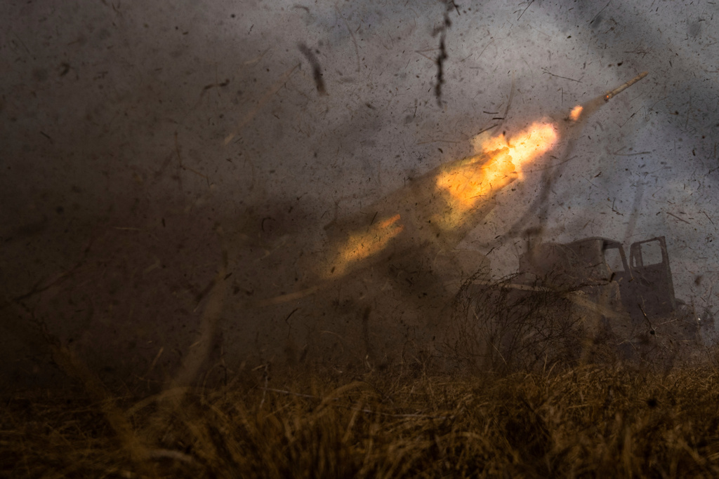 FILE - A Ukrainian MSLR BM-21 "Grad" rocket launcher of the 95 Air Assault brigade fires toward Russian positions on the front line near Kreminna, Ukraine, Thursday, March 9, 2023. (AP Photo/Evgeniy Maloletka, File)