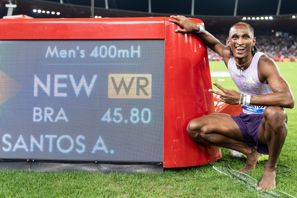 Brazil's Alison dos Santos celebrates after winning the men's 400-meter hurdles, setting a new world record, at the Diamond League athletics meeting, Thursday, Aug. 27, 2026, in Zurich, Switzerland. (Claudio Thoma/Keystone via AP)
