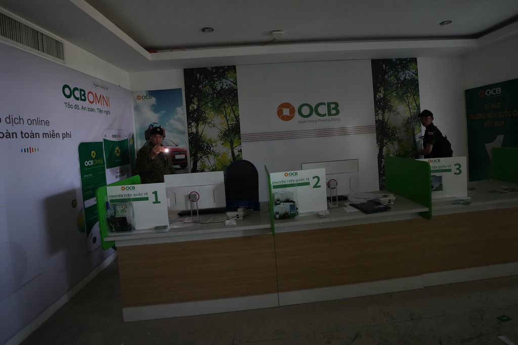 Thai soldiers inspect a scam compound in O'Smach, Cambodia, Monday, Feb. 2, 2026, (AP Photo/Sakchai Lalit)