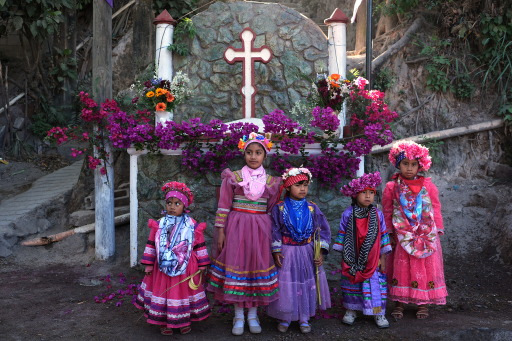 FILE - Catholic children representing angels pose for photos prior to joining the Palm Sunday commemoration in Santa Cruz Chinautla, Guatemala, March 29, 2026. (AP Photo/Moises Castillo, File)