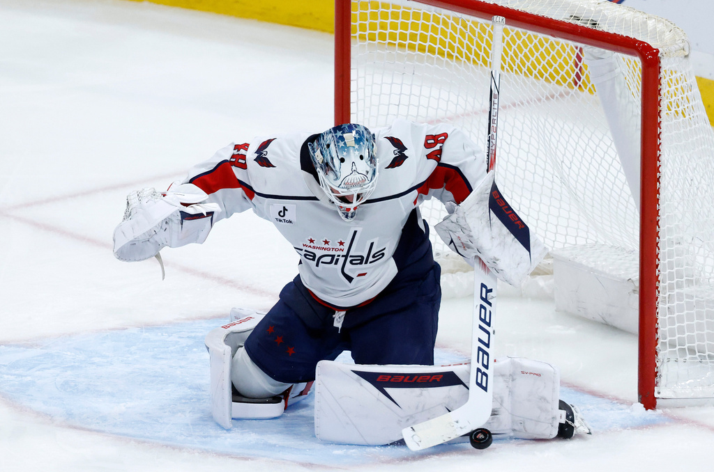 Washington Capitals goaltender Logan Thompson blocks a shot against the Florida Panthers during the second period of an NHL hockey game, Monday, Dec. 29, 2025, in Sunrise, Fla. (AP Photo/Rhona Wise)