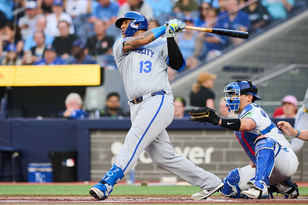 Kansas City Royals' Salvador Perez (13) grounds into a double play as Carter Jensen, not shown, scores against the Toronto Blue Jays during the second inning of a baseball game in Toronto, Tuesday, Aug. 25, 2026. (Sammy Kogan/The Canadian Press via AP)