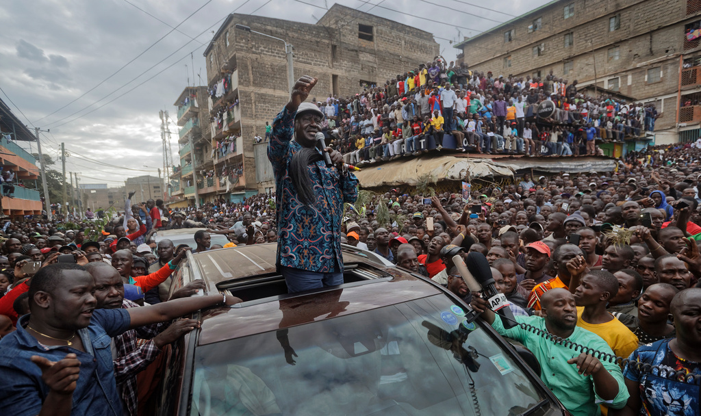 Kenyan opposition leader Raila Odinga gestures to thousands of supporters gathered in the Mathare slum of Nairobi, Kenya, Sunday, Aug. 13, 2017. (AP Photo/Ben Curtis)
