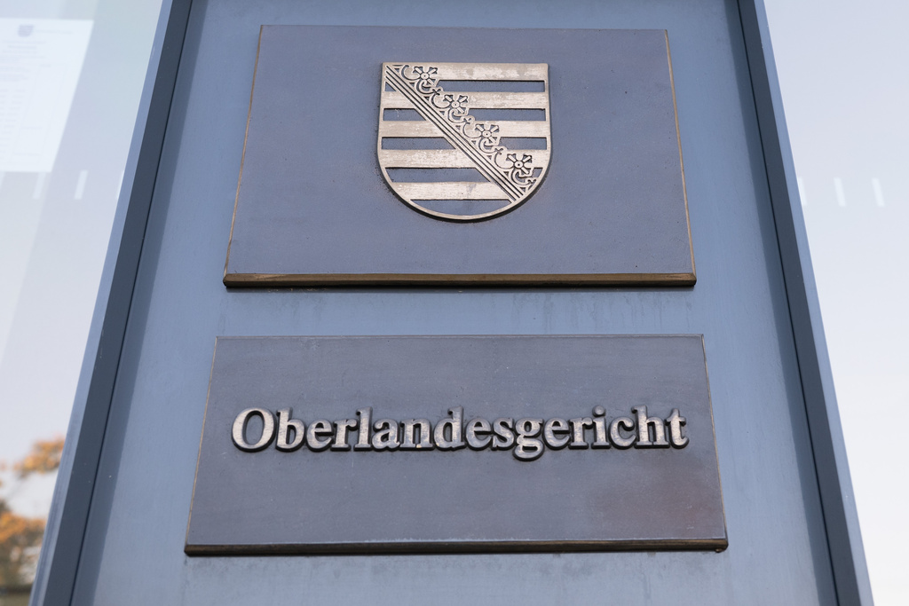 The words 'Oberlandesgericht' can be read on a pillar in front of the Dresden Higher Regional Court in Dresden, Germany, Tuesday, Sept. 30, 2025. (Sebastian Kahnert/dpa via AP)