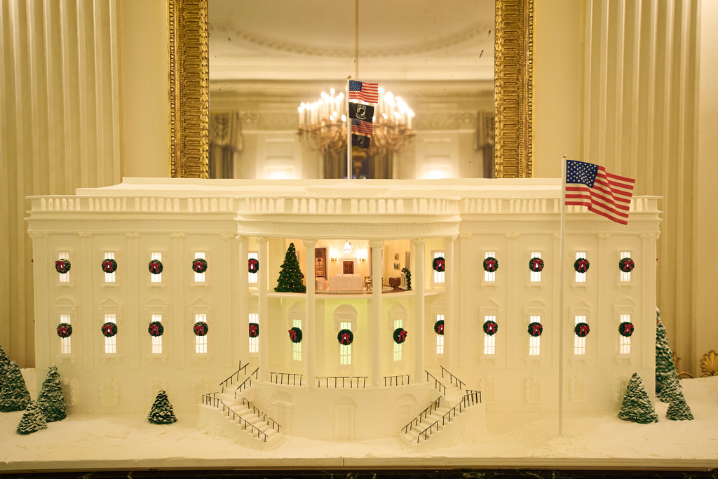 A Ginger Bread House decorates the State Dining Room of the White House during a press preview of the Christmas decorations "Home is Where the Heart Is," Monday, Dec. 1, 2025, in Washington. (AP Photo/Evan Vucci)