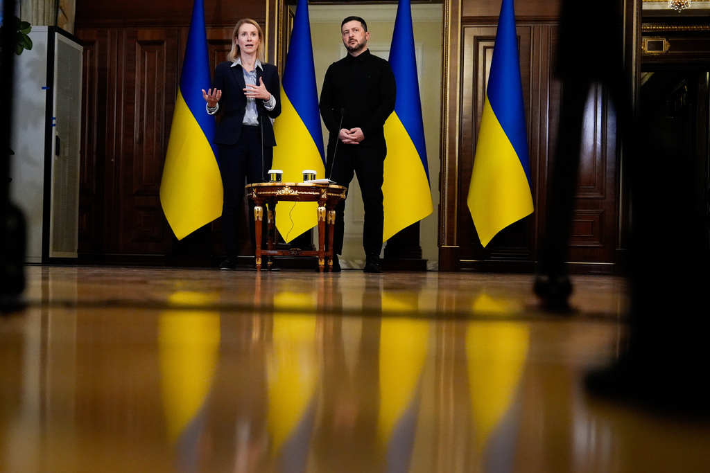 Ukraine's President Volodymyr Zelenskyy listens as High Representative of the European Union for Foreign Affairs and Security Policy Kaja Kallas speaks during a news conference, Monday, Oct. 13, 2025, in Kyiv, Ukraine. (AP Photo/Julia Demaree Nikhinson)