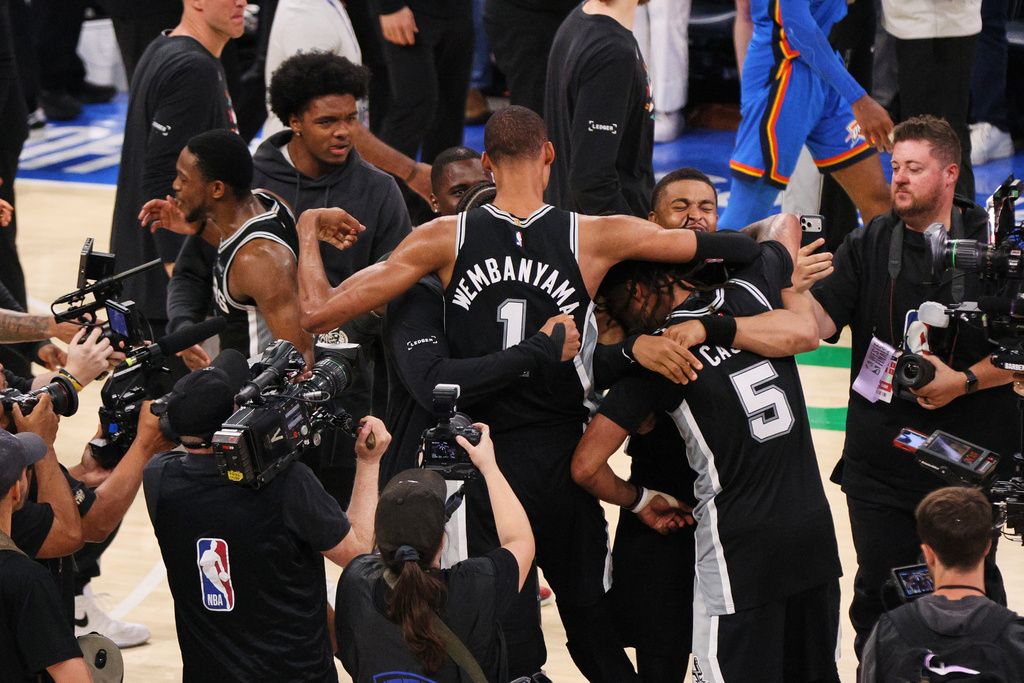 San Antonio Spurs forward Victor Wembanyama (1) celebrates after defeating the Oklahoma City Thunder in the Western Conference finals of the NBA basketball playoffs series Saturday, May 30, 2026, in Oklahoma City. (AP Photo/Nate Billings)