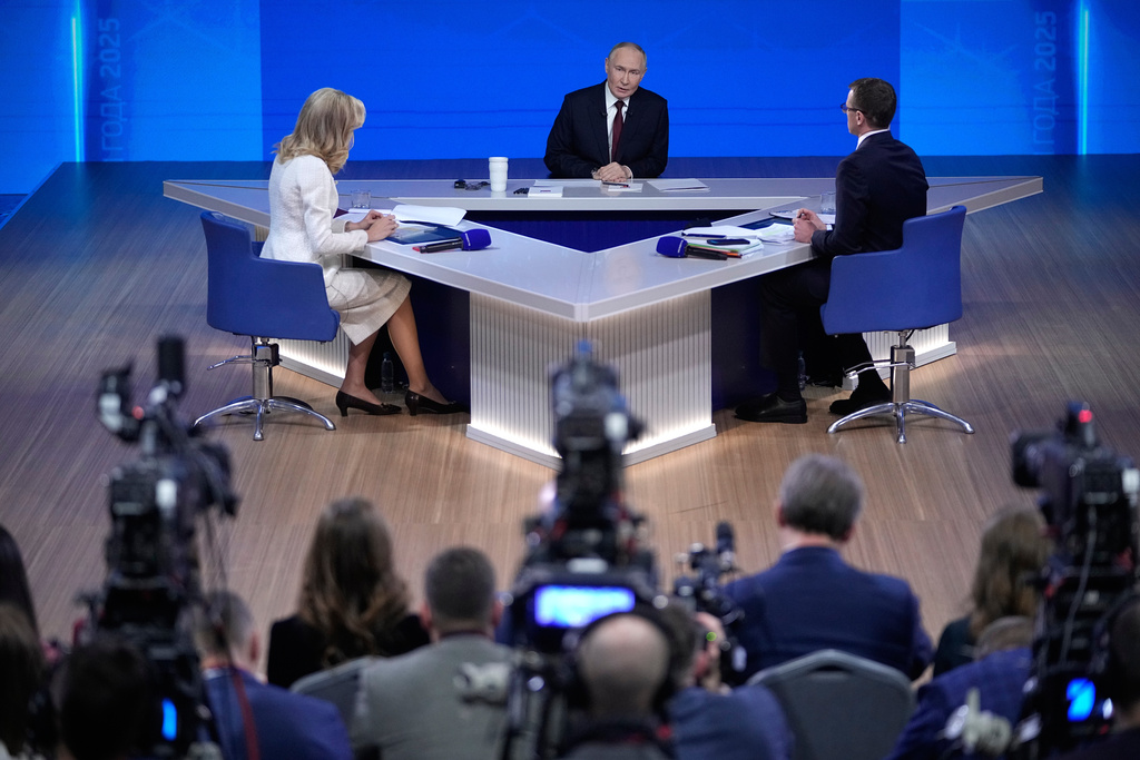 Russian President Vladimir Putin, center, speaks during his annual news conference and call-in show at Gostinny Dvor, in Moscow, on Friday, Dec. 19, 2025. (AP Photo/Pavel Bednyakov)