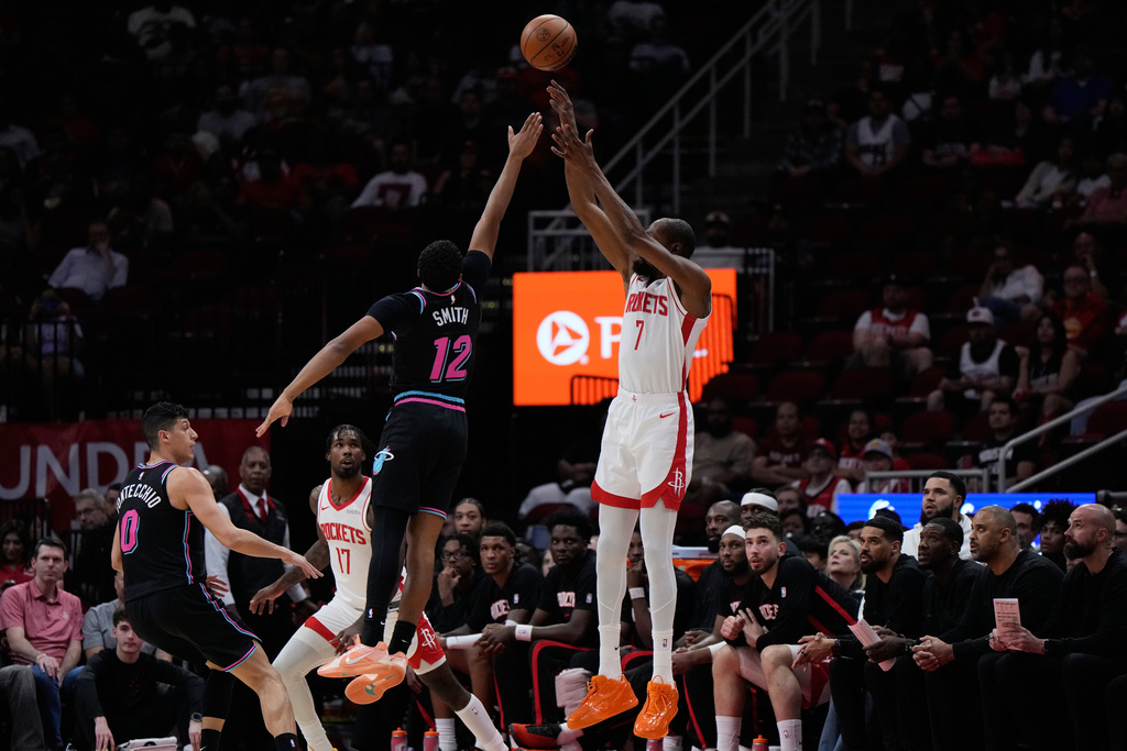 Houston Rockets forward Kevin Durant (7) shoots against Miami Heat guard Dru Smith (12) during the first half of an NBA basketball game in Houston, Saturday, March 21, 2026. (AP Photo/Ashley Landis)