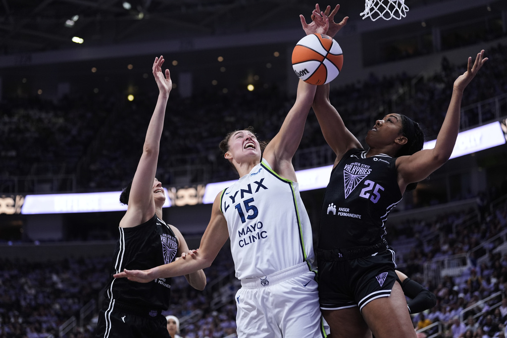 Minnesota Lynx forward Jessica Shepard (15) and Golden State Valkyries forward Monique Billings (25) compete for possession of the ball during the first half of Game 2 in the first round of the WNBA basketball playoffs Wednesday, Sept. 17, 2025, in San Jose, Calif. (AP Photo/Godofredo A. Vásquez)