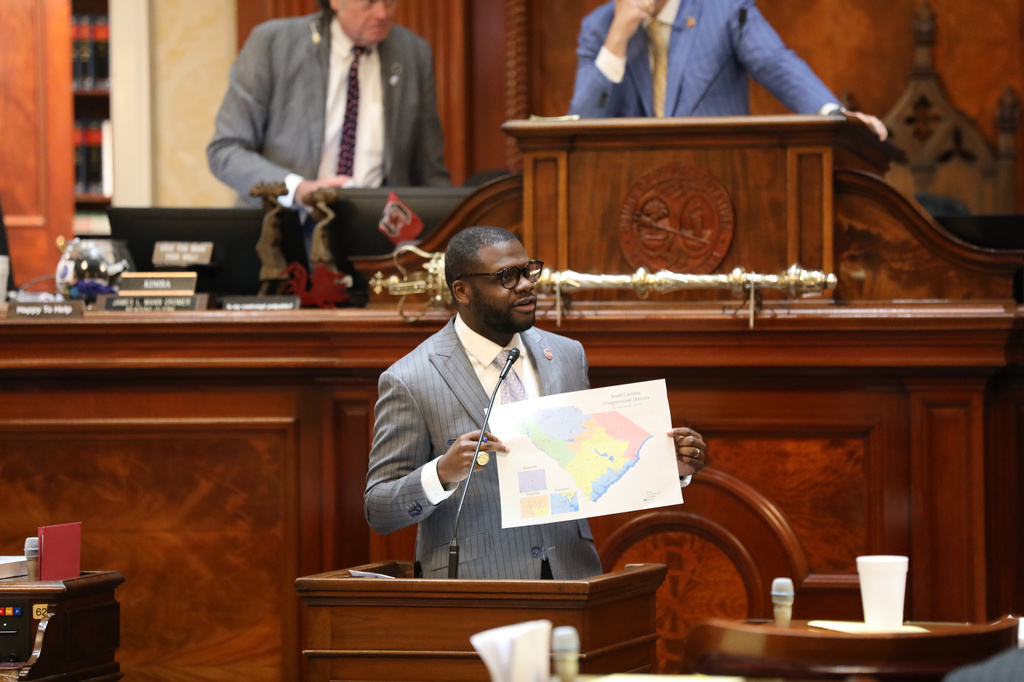 Democratic South Carolina Rep. Kambrell Garvin presents his version of a map for new congressional districts during the House session on redistricting on Monday, May 18, 2026, in Columbia, S.C. (AP Photo/Jeffrey Collins)